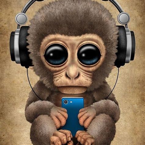 cute baby monkey  cell phone wearing headphones jeff bartels