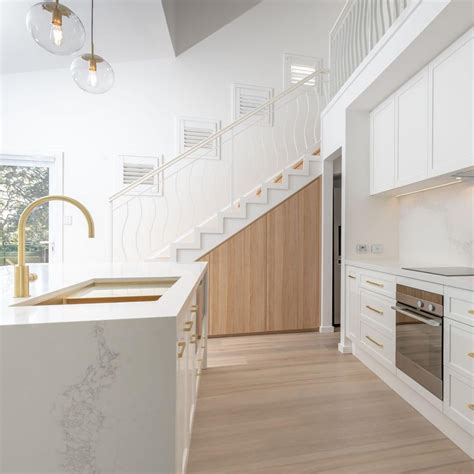 A distinctly modern space, minimalist in its purest form, with white lines and bright white paint complemented by the choice of transparent perspex chairs. Award-winning elegance with Caesarstone® Calacatta Nuvo ...