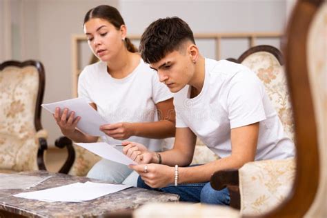 Realtor Helping Young Man Fill Out Paperwork Stock Photo Image Of