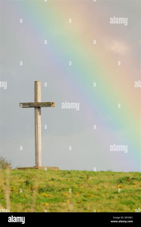 Cross With Rainbow In Background Stock Photo Alamy