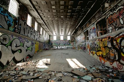 Abandoned Building With Messy Floor And Graffiti Walls · Free Stock Photo