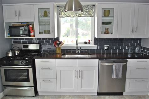 The white cabinets looked good by themselves, but, we wanted to add a little something special to make them appear better than just old cabinets repainted how often you need to oil you new butcherblock countertop. Ikea Ramsjo White cabinets and Lumber Liquidators American ...