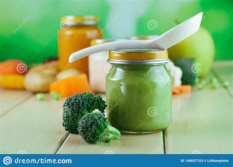 Let's check how to make this healthy broccoli potato puree for babies. Broccoli Puree In Glass Jar On Wooden Background With Copy ...