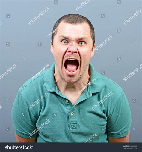 Portrait Angry Man Screaming Against Gray Stock Photo 414806122