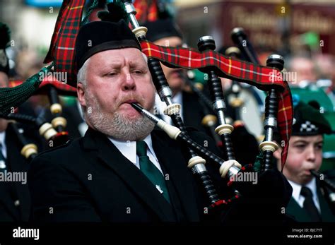 A Piper Playing The Bagpipes During The St Patricks Day Parade In
