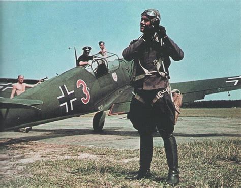 A Pilot Gearing Up Before Flight In His Messerschmitt Bf 109e1 “red 3
