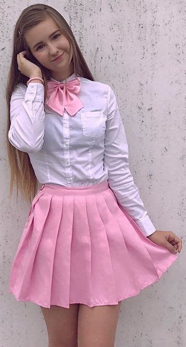Girl Dressed Formal At Home In White Shirt Pink Bow And Pink Skirt