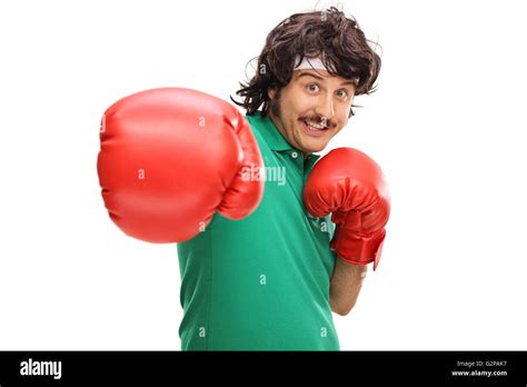 Retro Looking Guy With Red Boxing Gloves Throwing A Punch Towards The Camera Isolated On White