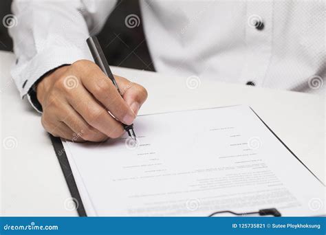 Person Signing On Document Royalty Free Stock Photo