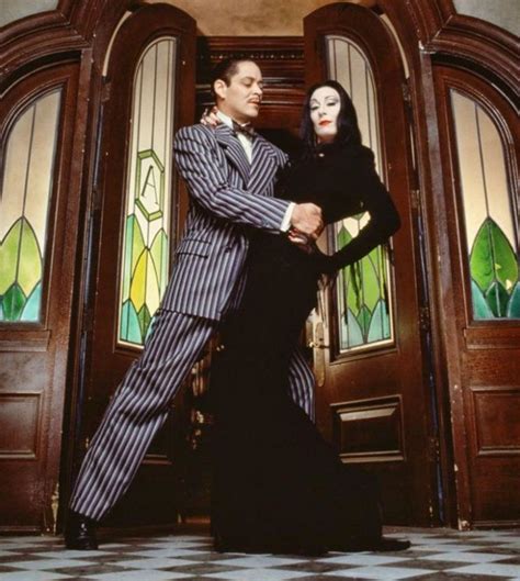 Anjelica Huston July 8 1951 As Morticia Addams And Raul Julia March 9 1940 October 24