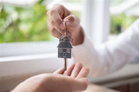 Real Estate Agent Hand Giving A House Keys To House Buyer Real
