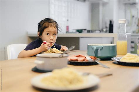 Adorable Girl Eating At Home By Stocksy Contributor Maahoo Stocksy