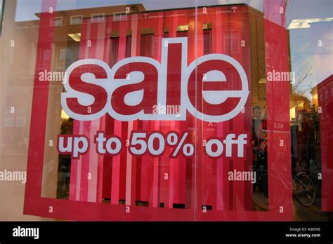 Sale posters in shop window Stock Photo: 6117343 - Alamy