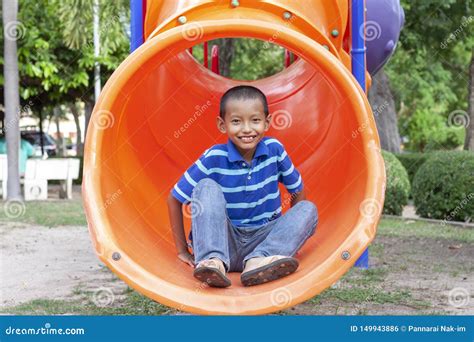 Boy Playing The Slide On The Playground Stock Photo Image Of Little