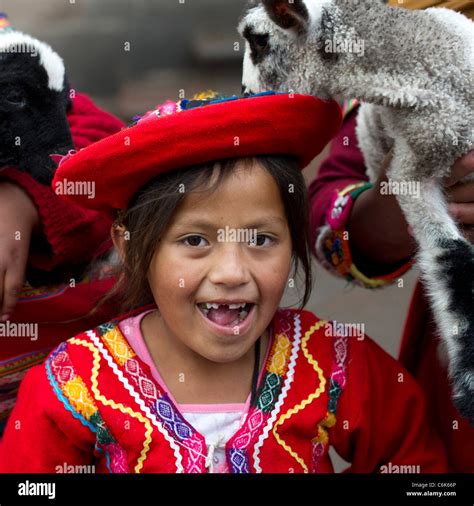 Portrait Of A Quechua Indian Girl With Kid Goats Cuzco Peru Stock