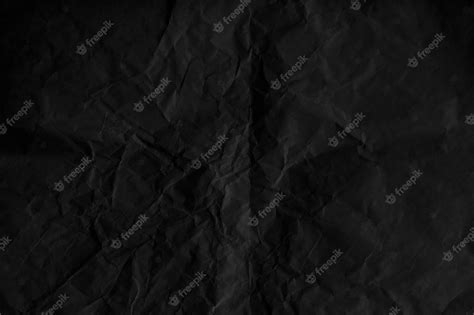 Premium Photo Crumpled Black Paper Textured Background