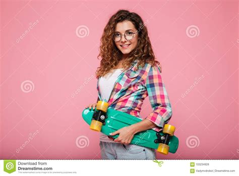 Young Pretty Woman In Eyeglasses Holding Skateboard Stock Photo Image