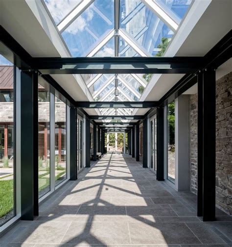 Glass Panel And Steel Trusses Covered Walkway Connecting The New