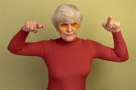 Free Photo Confident Old Woman Wearing Red Turtleneck Sweater And Sunglasses Looking And