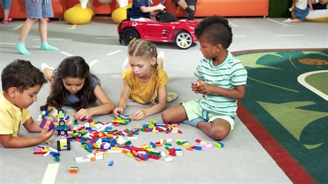 Group Of Kids Playing With Block Toys Children Playing Together With