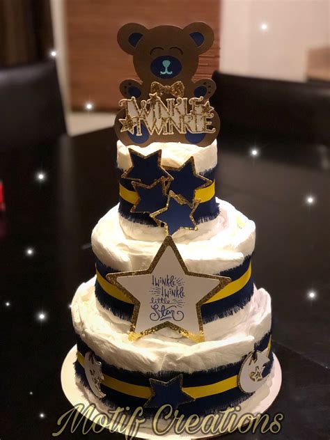 A Three Tiered Cake Decorated With Stars