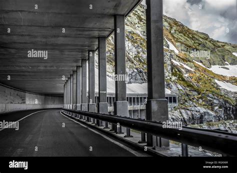 Mountain Road With Open Tunnel With Snow In Switzerland Stock Photo Alamy