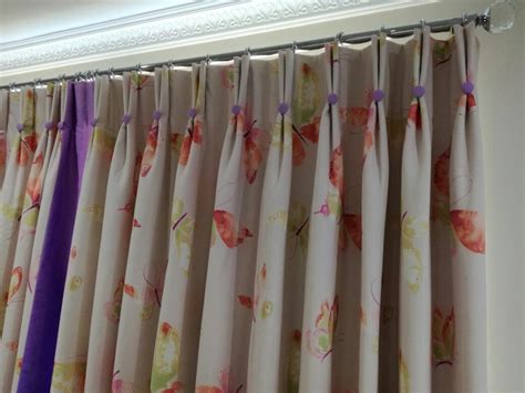 A Double Pinch Pleat Curtain With Contrasting Leading Edge And Marching
