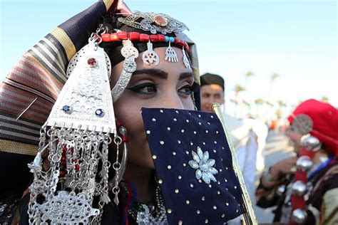 A Libyan Woman Dressed In Her Countrys Traditional Outfit Takes Part