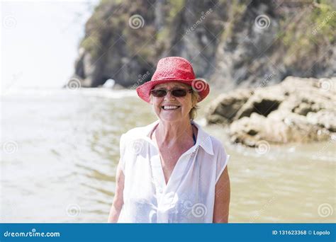 A Mature Senior Woman On The Beach Stock Photo Image Of Active Coast