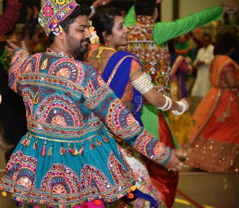 Girls Man Women Are Performing Garba And Dandiya Dance Wearing