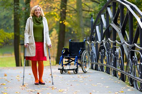 Woman Practicing Walking On Crutches Stock Photo Download Image Now
