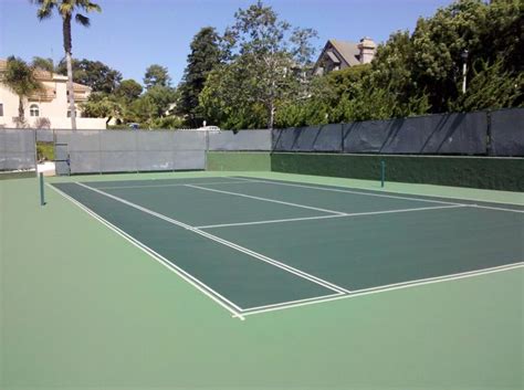 Traditional Green Tennis Court With A Lighter Green Wrap Around
