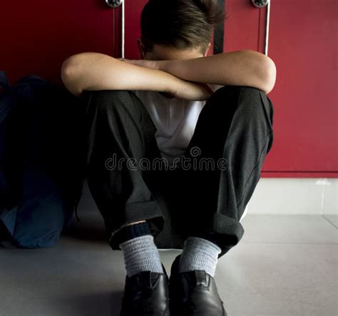 Boy Sitting Alone Resting Head On His Arms Stock Image Image Of Alone