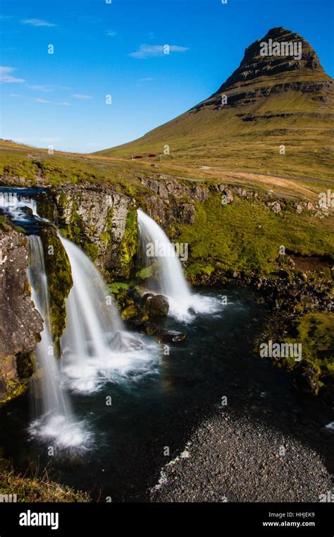 Kirkjufellsfoss Waterfall And Kirkjufell Mountain Snæfellsnes