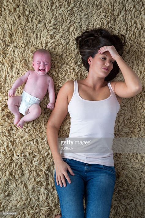 Stressed Mother And Her Baby High Res Stock Photo Getty Images