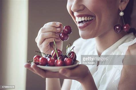 Women Eating Cherries Photos And Premium High Res Pictures Getty Images