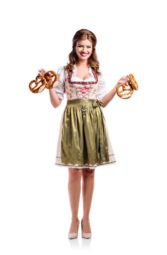 Beautiful Woman In Traditional Bavarian Dress Holding Pretzels Stock