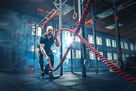 Men With Battle Rope Battle Ropes Exercise In The Fitness Gym
