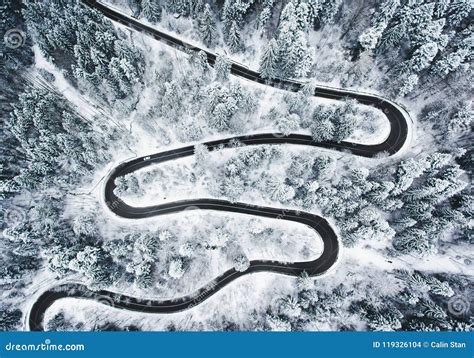 Winding Winter Road In And Forest Whit Trees Covered In Snow Stock