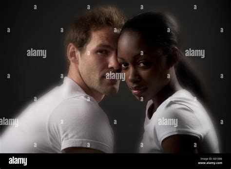 Interracial Couple Sharing And Intimate Moment Stock Photo Alamy