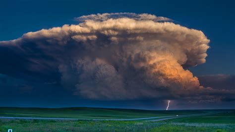 A Storm Of Color Isolated Supercell Tornado Rainbow And Lightning