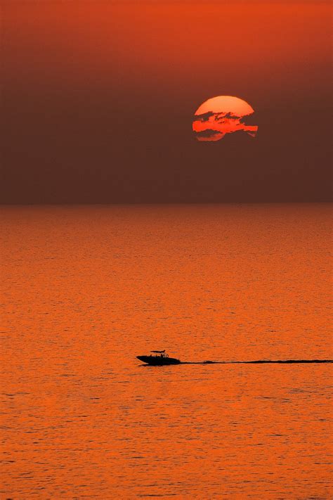 Boat Cruising On Sea At Sunset · Free Stock Photo