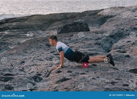 Man Doing Self Massage Of The Body With A Roll Fascia Training Stock Image Image Of Medicine