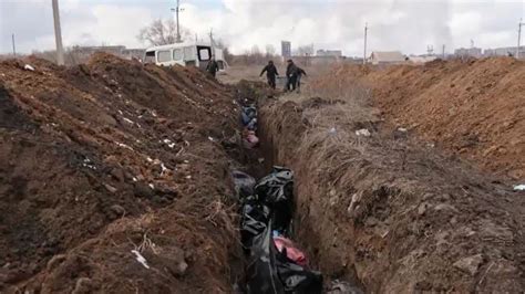Ukraine War Dozens Of Bodies Wrapped In Bags Or Carpet Buried In