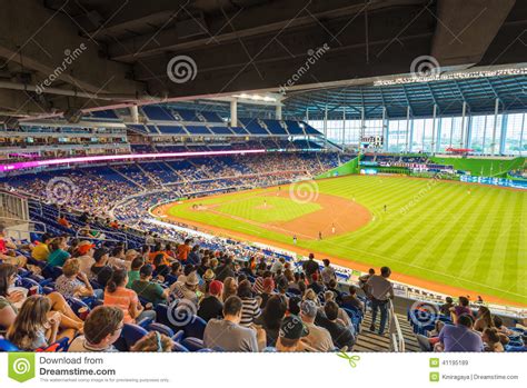 The miami marlins are a major league baseball team based in miami, florida. Fans Watching A Baseball Game At The Miami Marlins Stadium ...