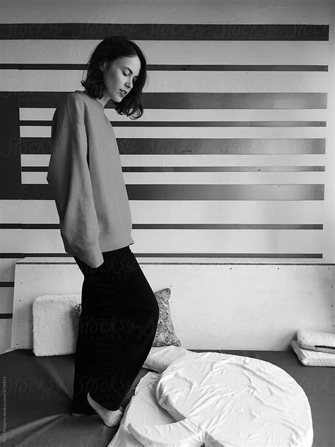 A Portrait Of A Beautiful Woman Standing On A Bed By Stocksy Contributor Anna Malgina Stocksy