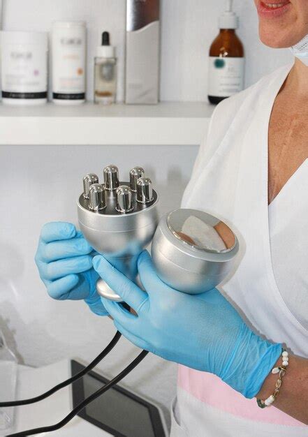 premium photo cosmetologist holds in his hands a medical device for face and body skin care