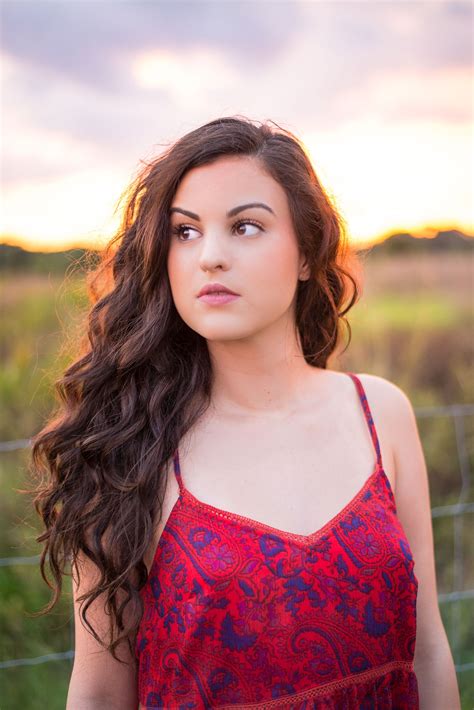 Senior Portraits In A Field During Magic Hour Done In Tampa Florida By