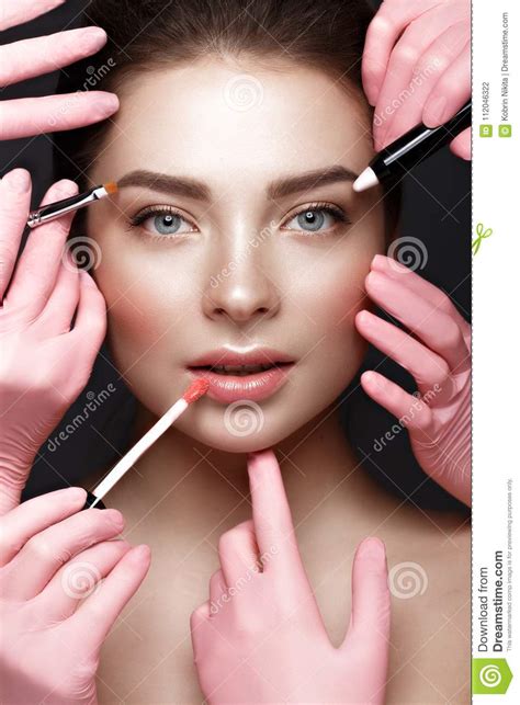 Beautiful Young Girl With Natural Nude Make Up With Cosmetic Tools In