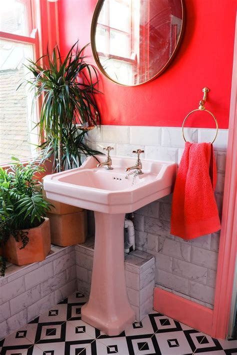 Browse bathroom designs and decorating ideas. Bright pink bathroom decor with blush pink sink and black ...